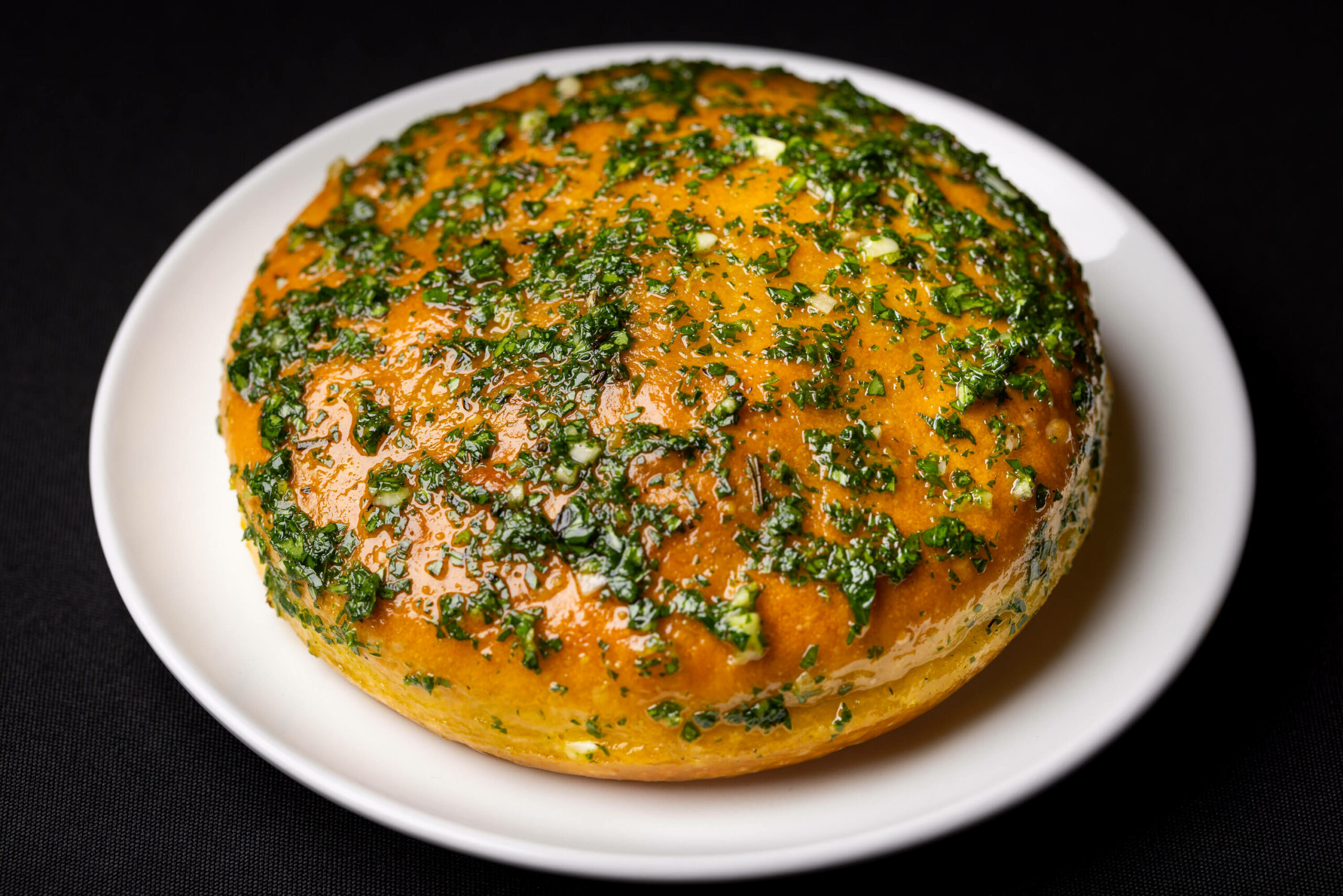 A detailed aerial shot showcasing the texture and seasoning on the focaccia.